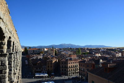 Townscape against clear blue sky