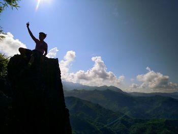 Low angle view of landscape against blue sky