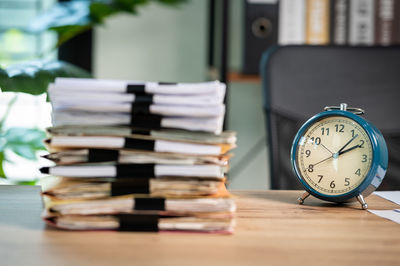 Close-up of clock on table