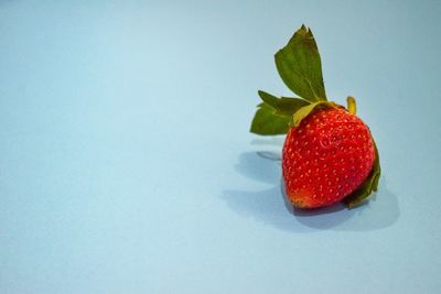 Close-up of strawberry over white background