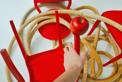 Close-up of hand holding red apples