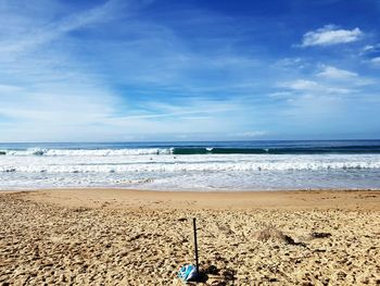 Scenic view of beach against sky