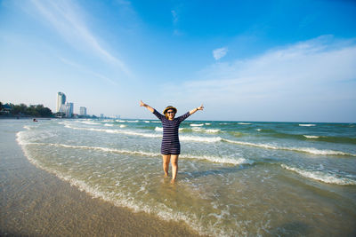 Woman standing on beach