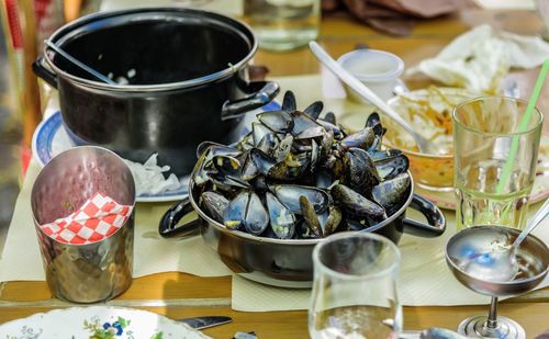 High angle view of clams in utensil on table