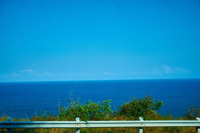 Scenic view of sea against blue sky