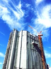 Low angle view of building against cloudy sky