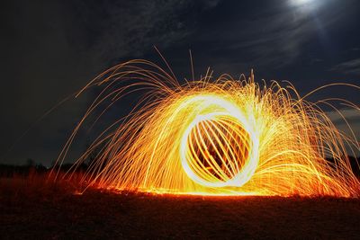 Light trails against sky at night
