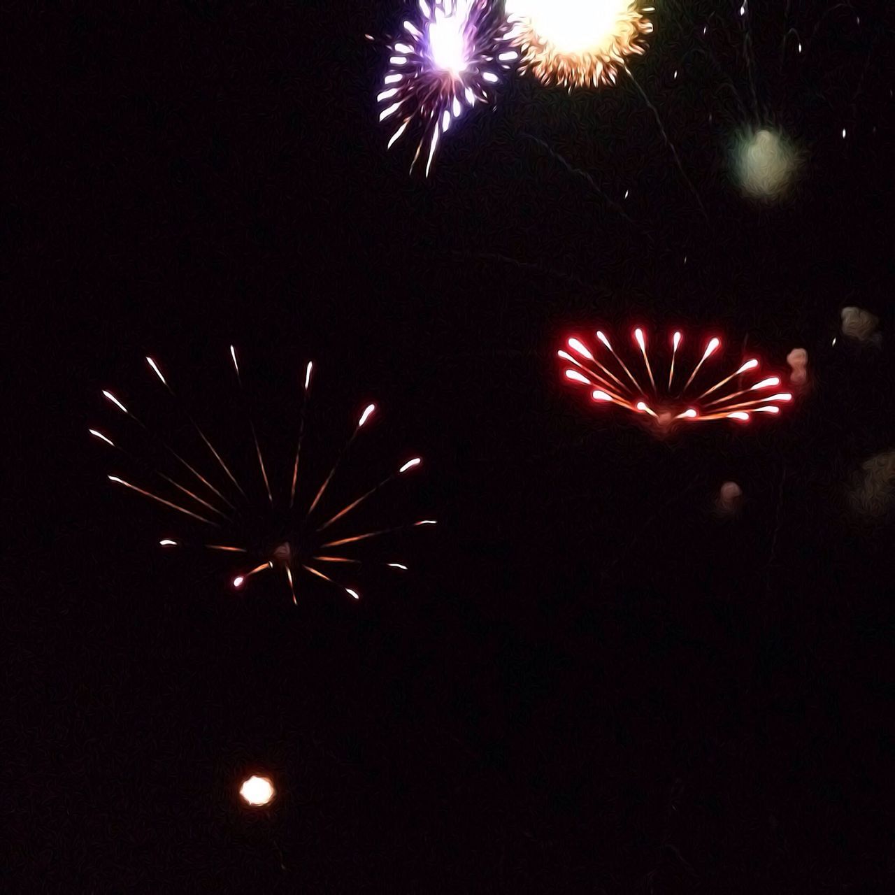 night, celebration, firework display, illuminated, exploding, firework - man made object, event, arts culture and entertainment, glowing, sparks, long exposure, firework, entertainment, motion, low angle view, celebration event, sky, multi colored, blurred motion, outdoors