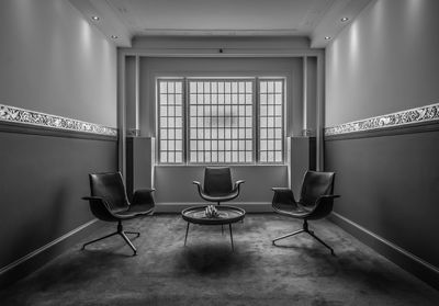 Empty chairs and table at home