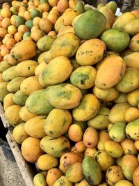 High angle view of mango fruits for sale at market stall