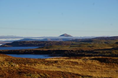 Scenic view of landscape against clear blue sky