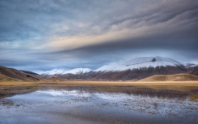 Scenic view of snowcapped mountains against sky