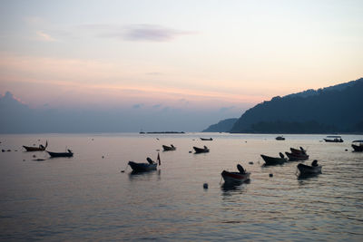 Scenic view of sea against sky at sunset