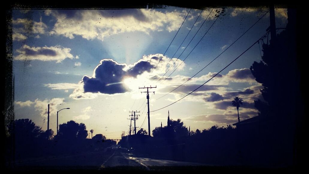 power line, electricity pylon, sky, electricity, silhouette, power supply, transfer print, cloud - sky, transportation, cable, road, sunset, car, power cable, connection, cloud, street, cloudy, tree, street light