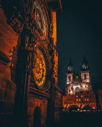 Low angle view of illuminated buildings at night
