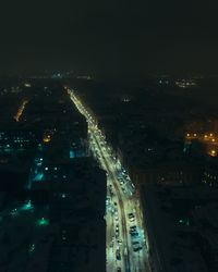 High angle view of illuminated city buildings at night