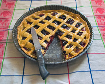 View of berry pie with missing bite