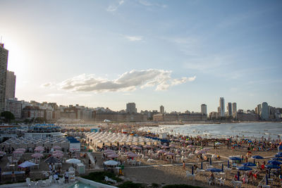 High angle view of buildings at beach against sky