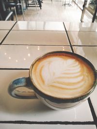 Close-up of cappuccino on table