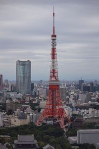 Tower in city against sky