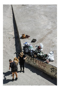 High angle view of people walking on road