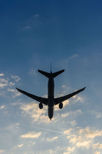 Low angle view of airplane flying in sky