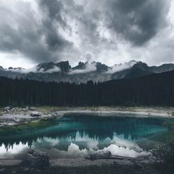 Scenic view of lake against sky during winter