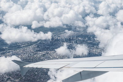 Aerial view of mountain against cloudy sky