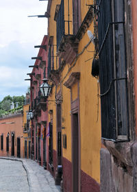 Alley amidst buildings in city