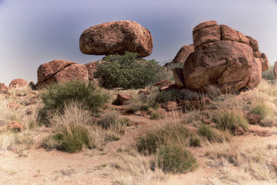 Rock formation on land against sky