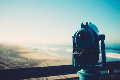Coin operated binoculars on beach