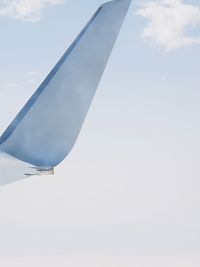 Low angle view of airplane flying in sky