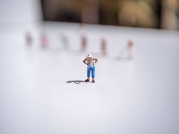 High angle view of boy standing on table