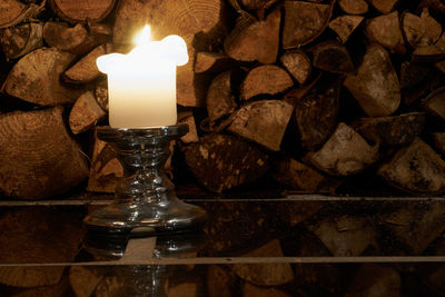 Close-up of illuminated lamp on table