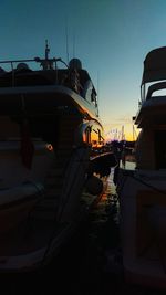 Boats moored at harbor