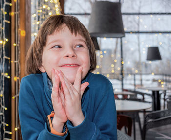 Portrait of smiling boy in restaurant