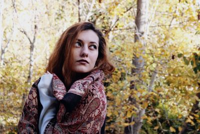 Portrait of a beautiful young woman in forest