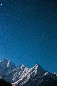 Majestic mountains against starry sky