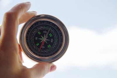 Cropped image of person holding camera