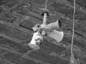 High angle view of electric lamp hanging on rope