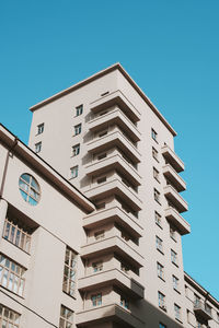 Low angle view of building against clear blue sky