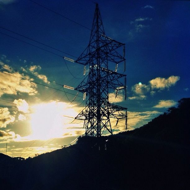 electricity pylon, power line, silhouette, sky, electricity, power supply, fuel and power generation, sunset, connection, low angle view, cable, technology, cloud - sky, cloud, nature, power cable, sunlight, tranquility, blue, outdoors