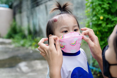 Portrait of a girl drinking water from outdoors