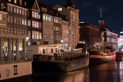 Illuminated buildings in city at night