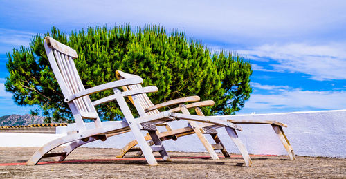 Empty wooden chairs outdoors