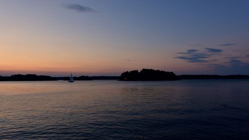 Scenic view of sea against sky at sunset