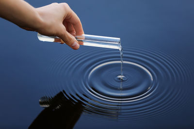 Close-up of hand holding water