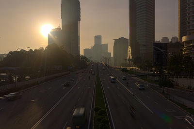 Highway in city at sunset