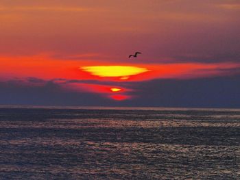 Scenic view of sea at sunset