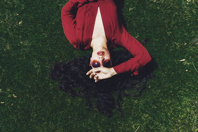 Portrait of smiling young woman on field